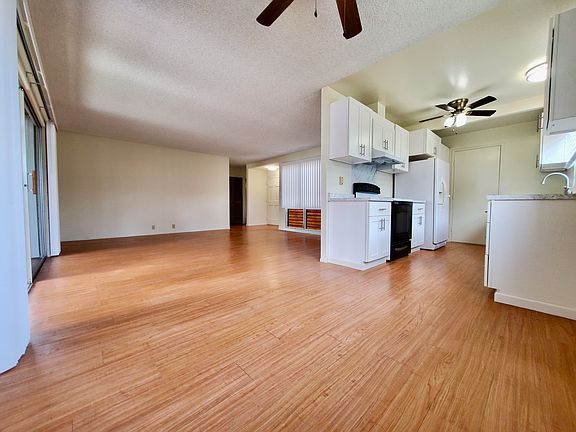 Open Concept Living Room and Dining Room with Ceiling Fan