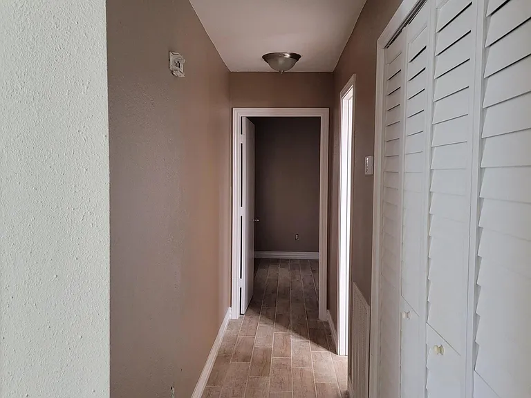 Hallway entry to 2nd Bathroom and Bedroom