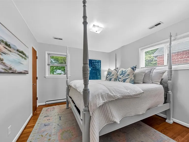 Primary bedroom (NE corner) with half bath