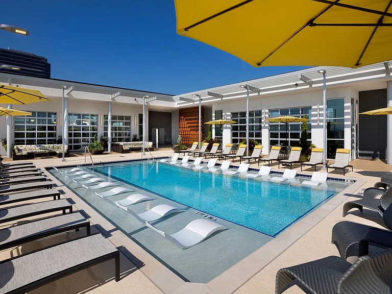 The fitness center overlooks the pool and city views