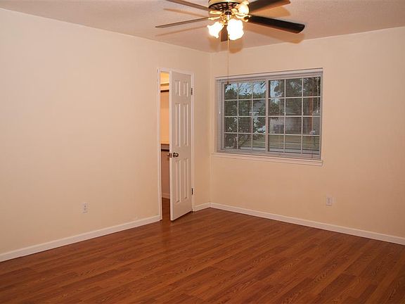 BEDROOM WITH WOOD LAMINATE FLOORING