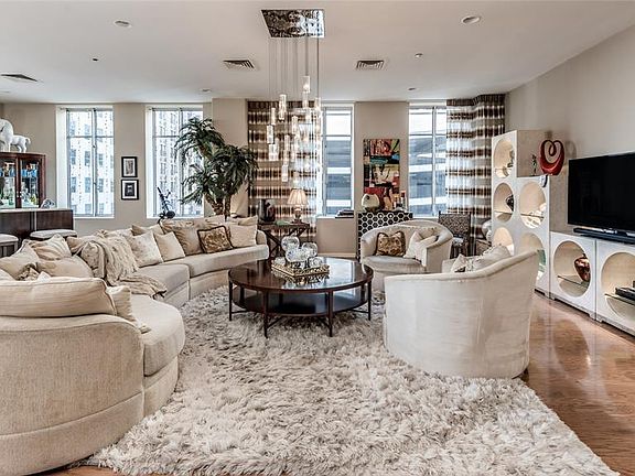 Downtown luxury living at its finest! Spacious 2 bedroom, 2.5 bath corner unit at the prestigious Commerce Towers! Living/Dining have hard wood floors for ease of living. Recessed lighting.