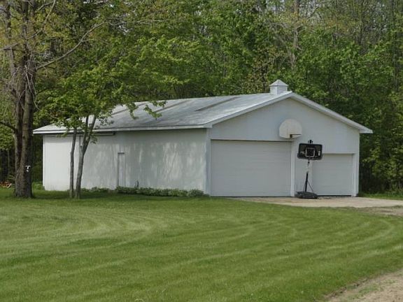 There's an incredible 30' by 54' pole barn with tall overhead doors complete with a cement floor as well as electricity.