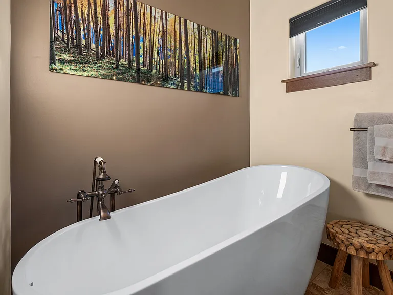 Extra long soaking tub and heated floors.