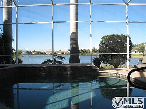 Imagine enjoying a cocktail with friends in your heated pool on the large lake.