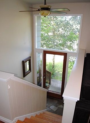 Wonderfully lit, split entry with lighted ceiling fan & huge windows for natural lighting.