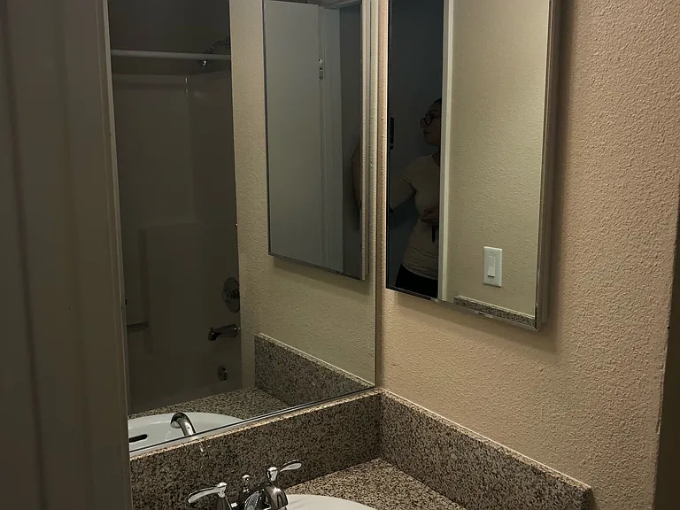 Hallway view into bathroom at Grande Vista Apartments.