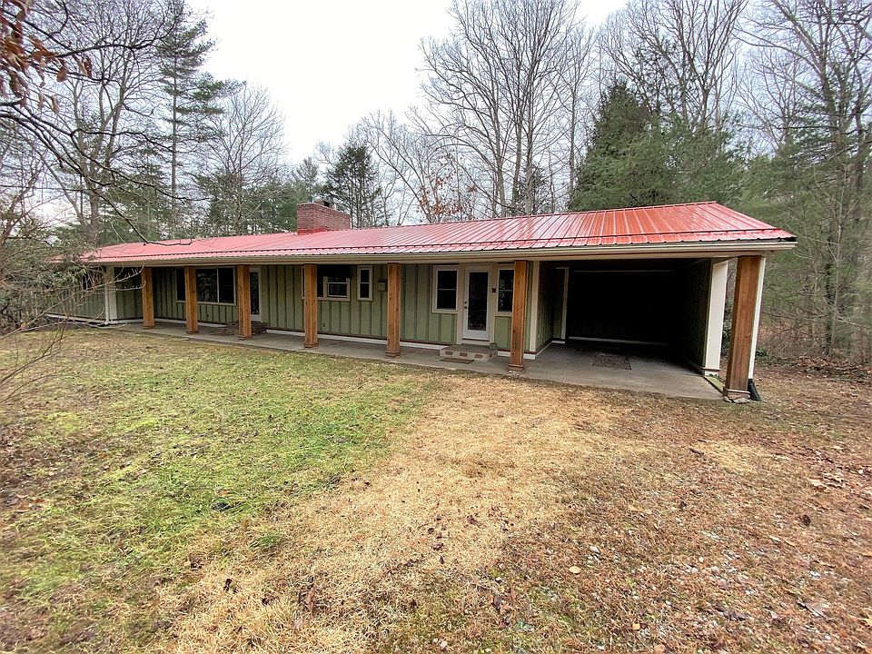Covered entry for both sides. Two separate driveways offer ample parking.