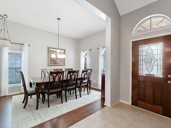 The dining room has plenty of room for a large tabel and additional furniture if desired. Note the high ceilings and abundance of light!