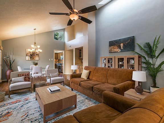 High ceilings, and skylights give this lovely one story townhome a sense of spaciousness. wood floors and tile throughout.