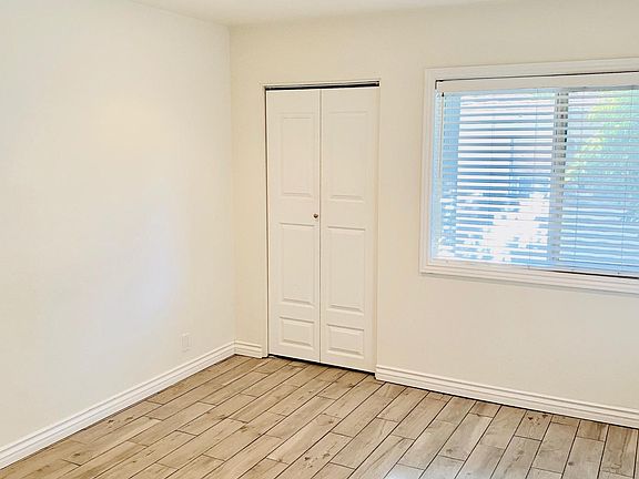 Main bedroom facing smaller closet and window.