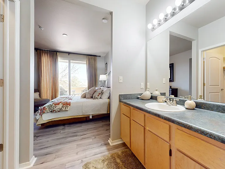 Relax in a bright, comfortable bedroom with an adjoining bathroom.