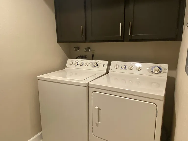 Downstairs laundry room with washer and dryer