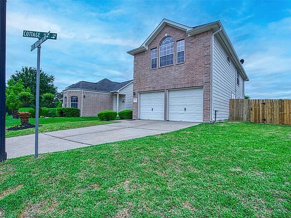 Driveway front entrance. 2-car attached garage. 75\% fenced is new.