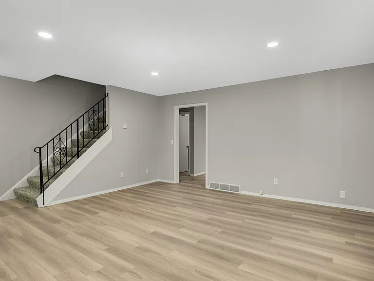 Bright, open main living space with brand new flooring and natural light