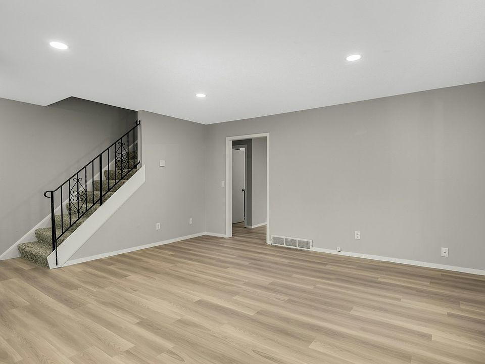 Bright, open main living space with brand new flooring and natural light