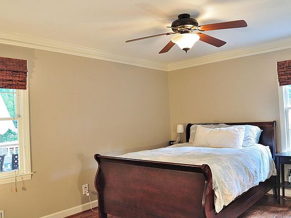 Master with two windows on back of home for a quiet retreat,