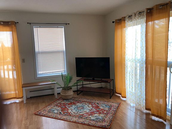 Living room with lots of light and multiple balconies