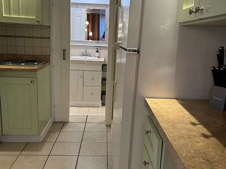 View from kitchen to bathroom entrance.
