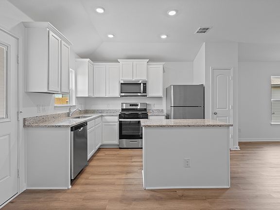 Granite countertops and stainless steel appliances in the kiichen