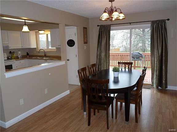 Dining area has newer sliding door to HUGE deck.