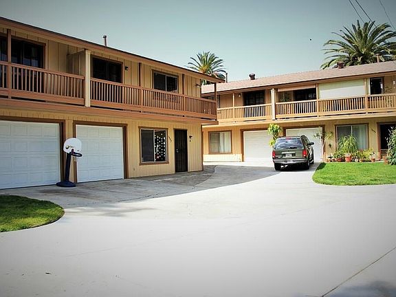 Left side unit is 3557 B exterior with small private lawn and deck on the other side.