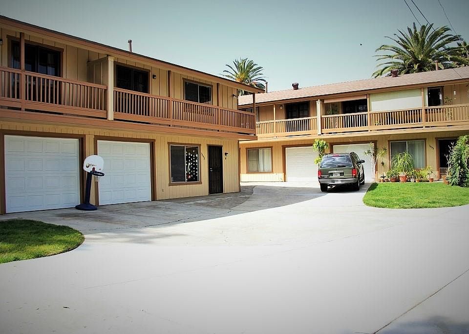 Left side unit is 3557 B exterior with small private lawn and deck on the other side.