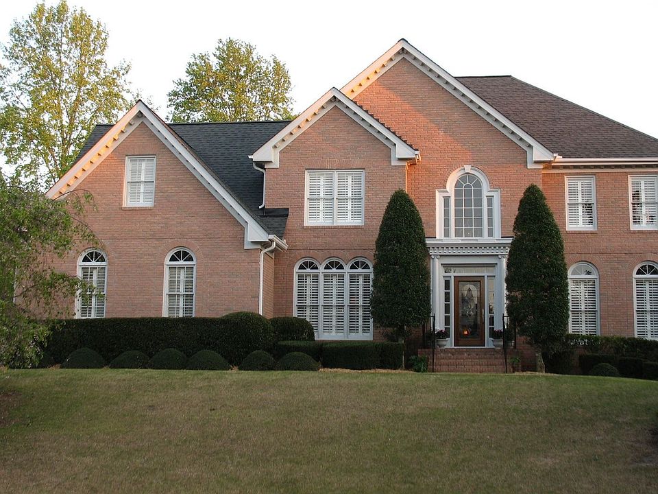 Brick executive home in Dunmoor with Salt Water Pool