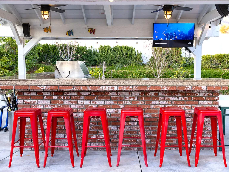 Cook and entertain year-round in the covered outdoor BBQ kitchen_perfect for grilling your favorites while enjoying fresh air and good company, rain or shine. Your ultimate alfresco dining experience awaits!