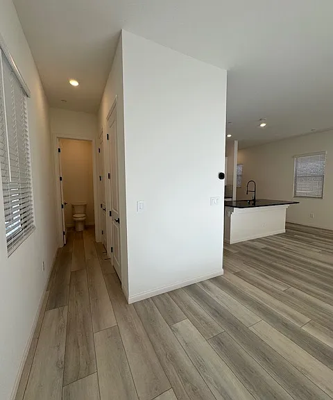 Hallway to private powder room and 2 extra closets