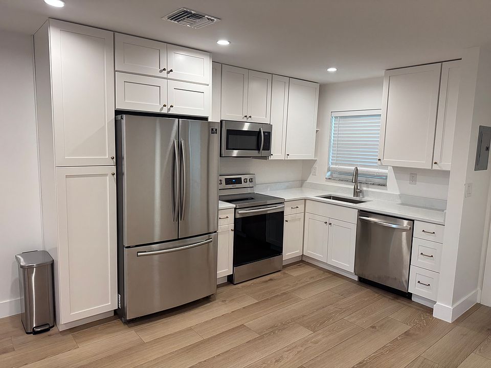 Brand new kitchen with stainless steel appliances