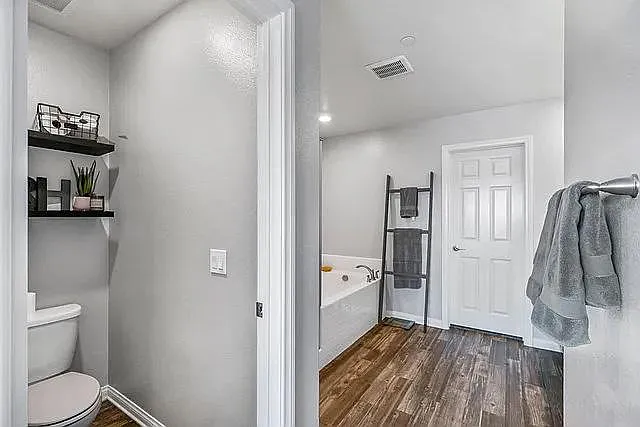 Primary bedroom's bathroom and separated toilet