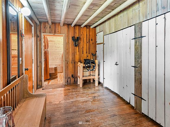 This is the entry foyer for the 1 bedroom portion of the "Barn", note the significant storage closet spaces.  Beyond the foyer is the main floor 3/4 bath (w/antique "claw-foot" tub).  Behind the photographer is the Kitchen/Dining room.>
