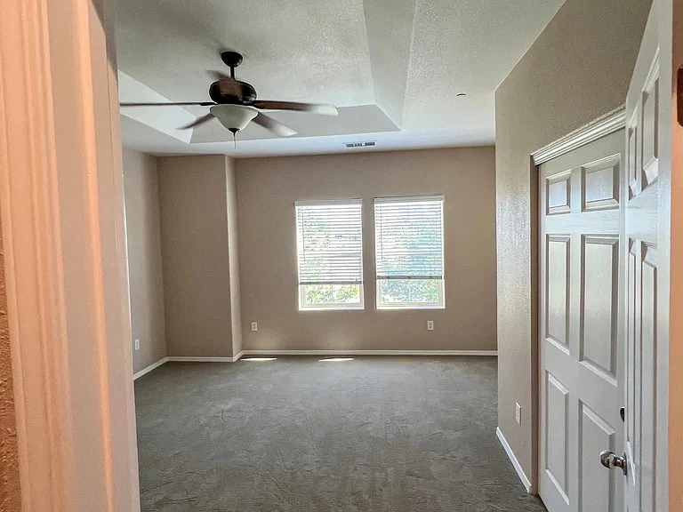 Entry to bedroom1. Closet doors on right.