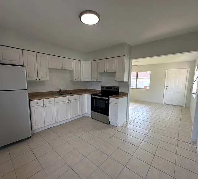 Kitchen view into Living area