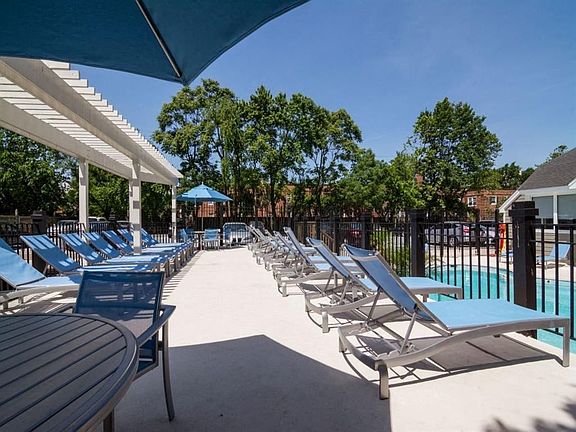 Sparkling Pool & Sundeck with Relaxing Lounge Chairs