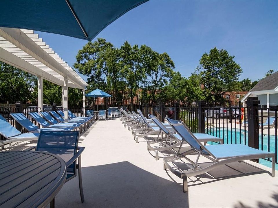 Sparkling Pool & Sundeck with Relaxing Lounge Chairs