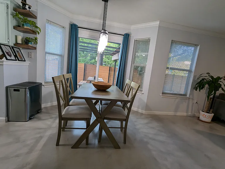 Dining area with the sliding door that leads to the outdoor dining area under the pergola