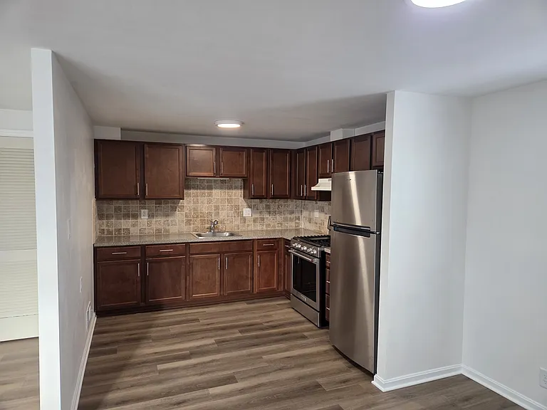Kitchen with new refrigerator and stove.