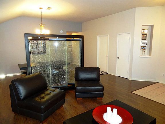 Wood laminate flooring in both formals den and halls.