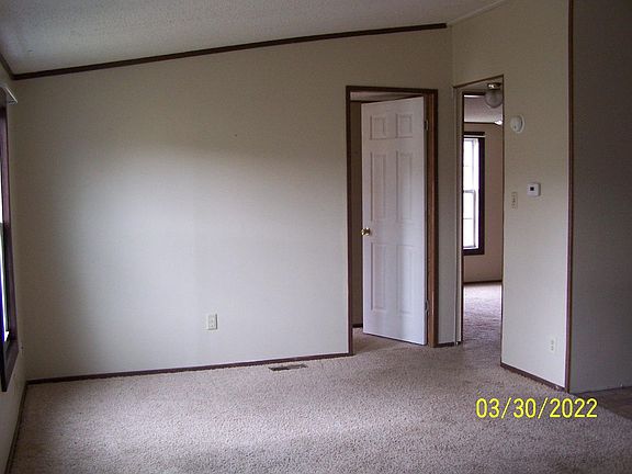 Inside front door - looking left into living room (toward 2 bedroom doors)