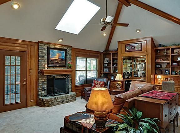 Great Room w/Fireplace  has Lovely Pool Views and Patio Access!