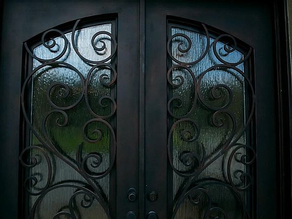 Stunning iron detail on the front door.