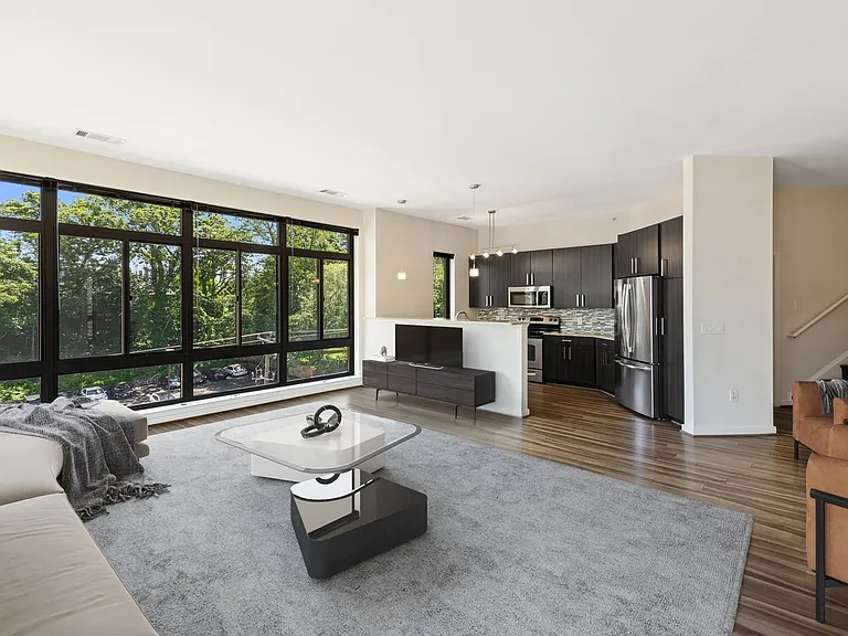 Spacious living rooms with wood flooring