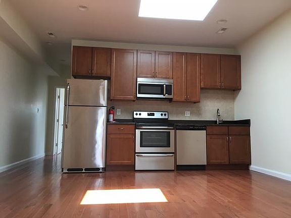 Living/kitchen area with skylights