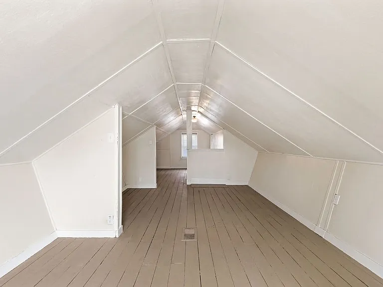 Spacious upstairs roomideal as a third bedroom or additional living area.
