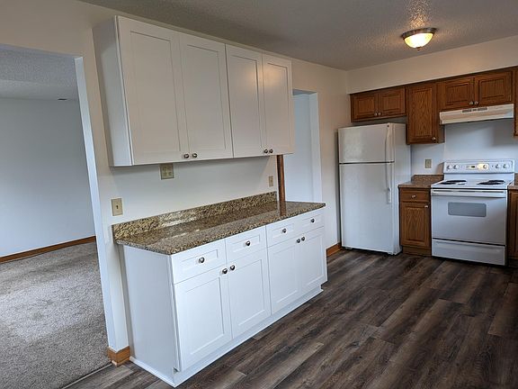 Kitchen has new cabinets with granite counter.