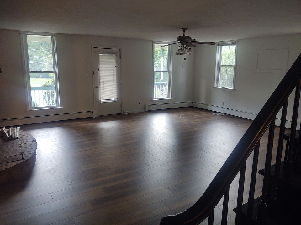 Huge Living Room with lots of windows.