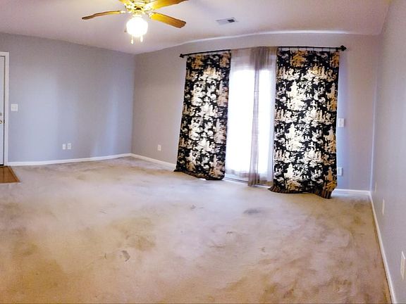 Living Room with ceiling fan.