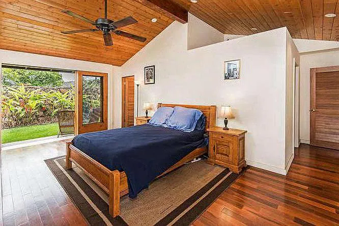 Master bedroom, with sliding doors open to private garden.